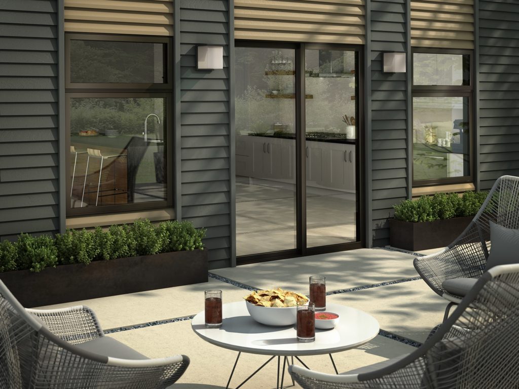 patio with replacement windows and black dutch lap siding