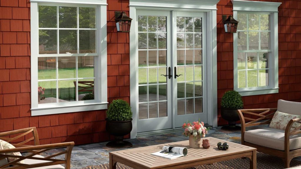 home with patio door and shake and scallop siding