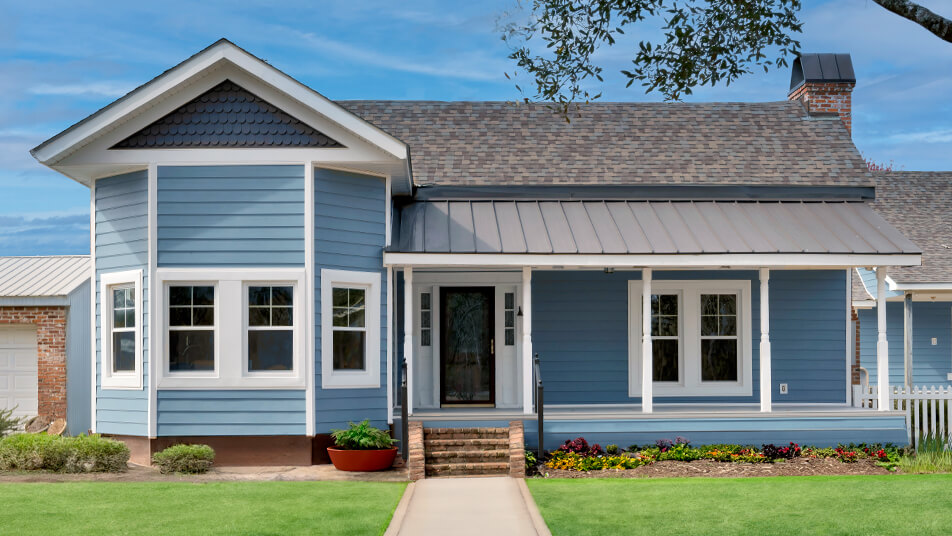 Blue ranch style house with double-hung windows